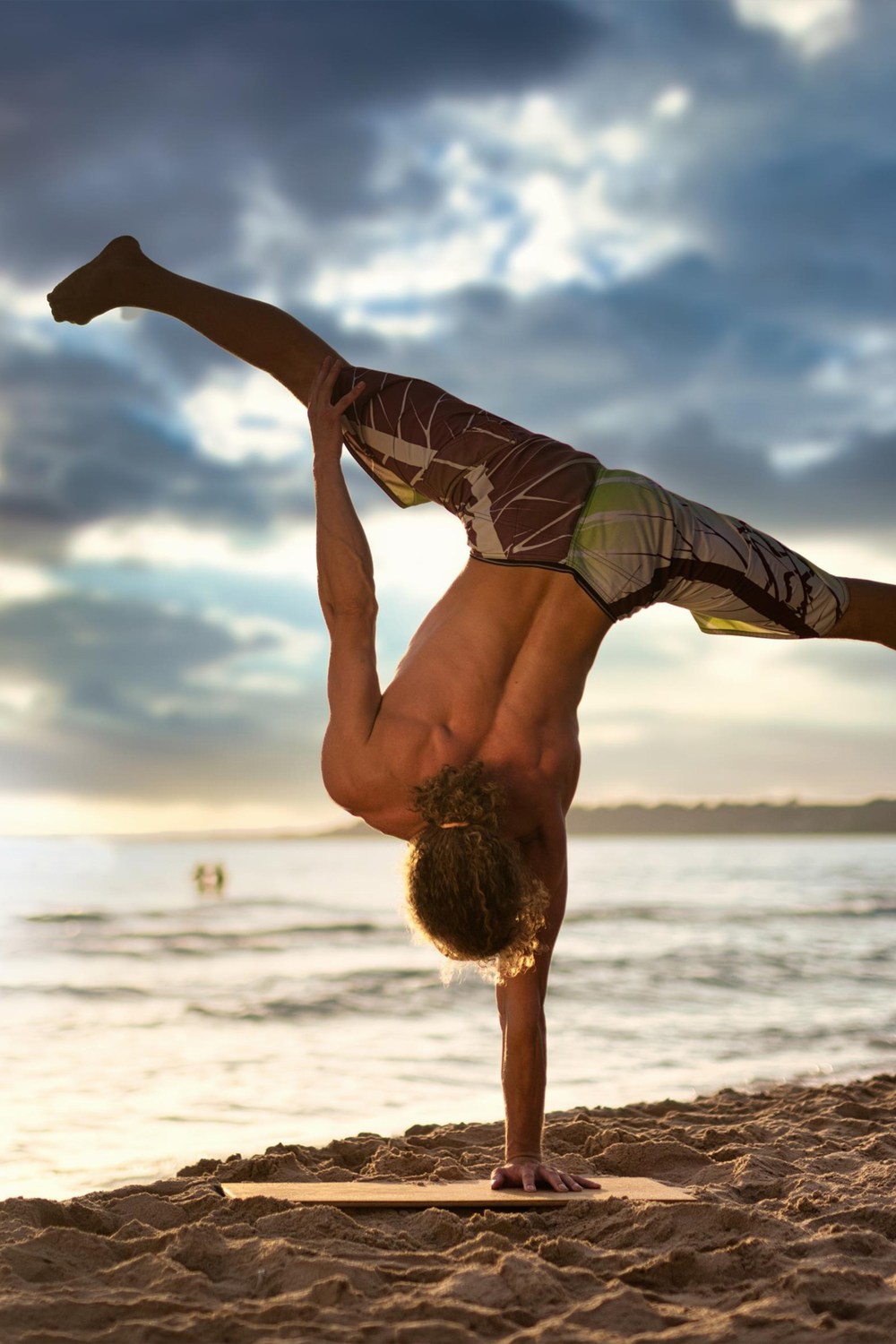 Handstand on the beach with beautiful light.
